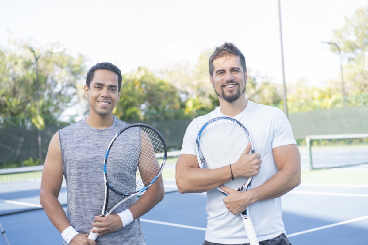 Two players greeting each other at the net before a match.